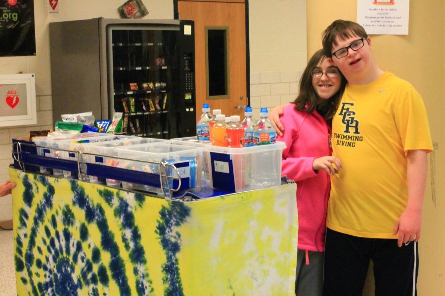 Left, Chris Boylen ‘19
and Emma Fiorenzo ‘17 pose by the Pioneer Trad- ing Post, where students can buy anything from a water bottle to a pack of gum.