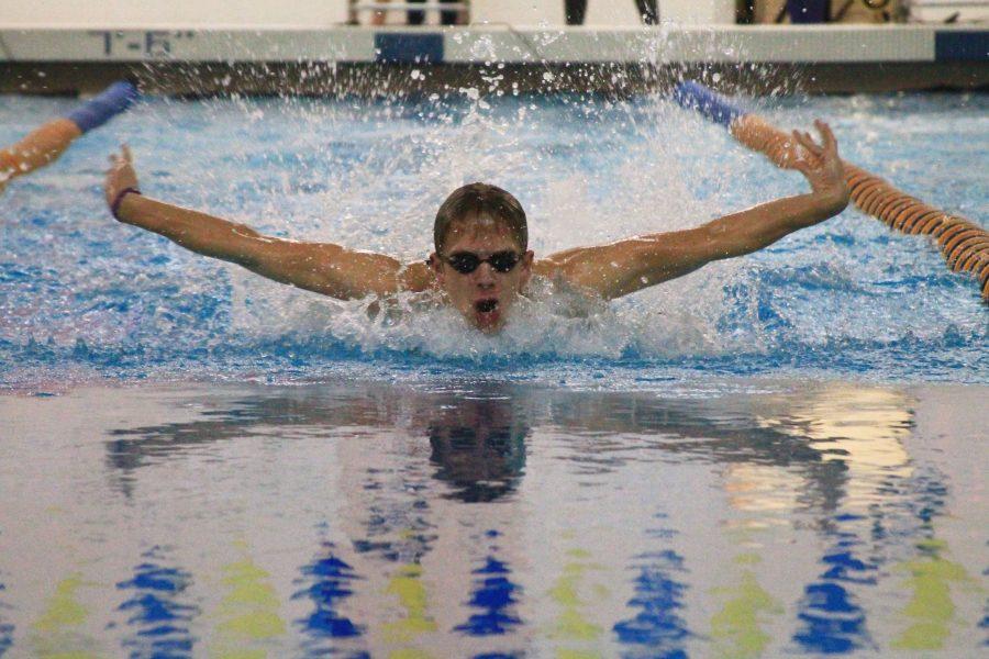 Cade Vruggink 17 competing in the 100 yard butterfly earlier this season at the home pool. 