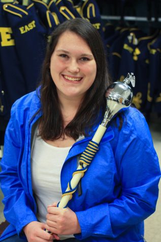 Lexi Willison '17 poses with her trusty baton that led the marching band through the football season this past fall. 