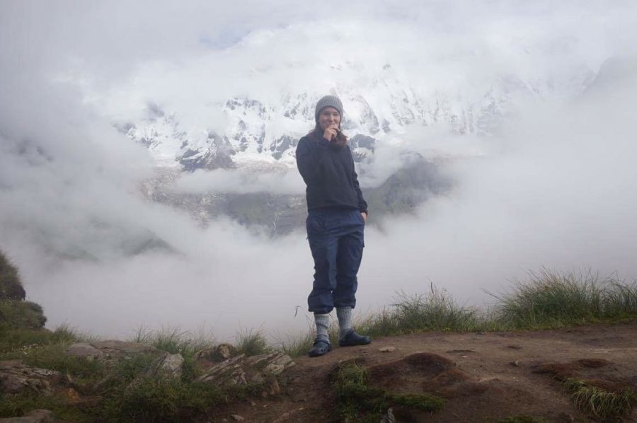 Jill Woodhouse 17 stands at Annapurna base camp. 