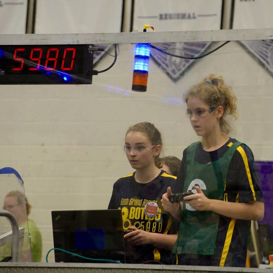 Carlie Couzens and Clara Luce 18 drive the robot together during the finals of the competition.