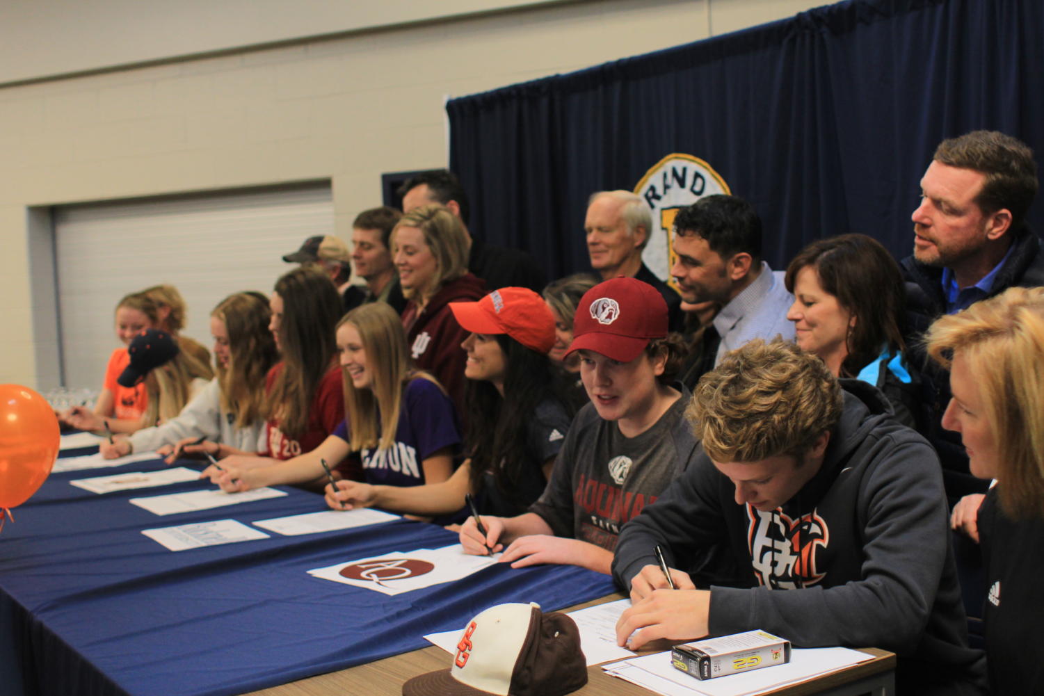 James Murray, Katie Persons, Mike Malewitz, Suzy Deems, Sara Vargo, Ileah Doctor, and Macy Alabitis '18 plan to continue their sports in college by signing to their respective colleges