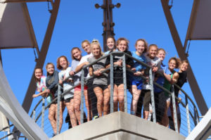 The girls cross country state team poses for a photo in Gaslight. These 14 girls are training for the November 3 race.