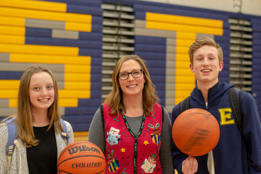 Chemistry teacher and coach Heather Carlson plays basketball with junior son Brendan and freshman daughter Alli.
