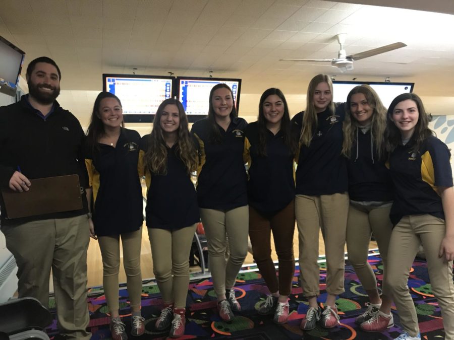 The girls bowling team with coach Zach Wiener.