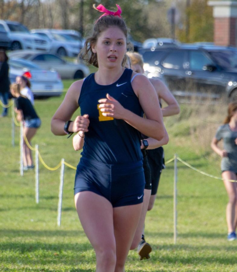 Maddy Mayor 19 runs her final race as a senior at Otsego High School on October 24, 2018.