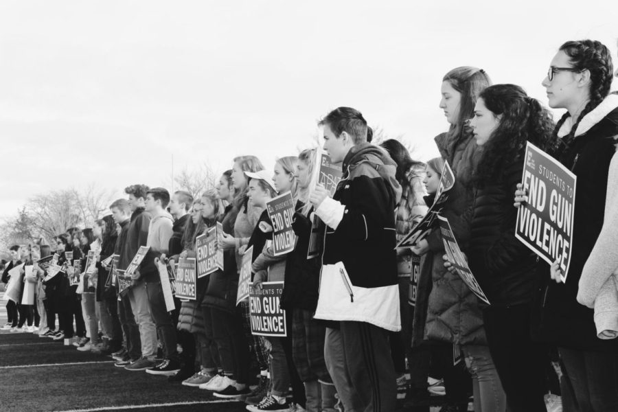 EGRHS+students+holding+signs+during+the+school+walkout+in+March+2018.