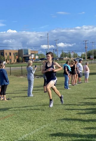 Eli Robinson 23 strains towards the finish line at Gainey Athletic Complex Wednesday.