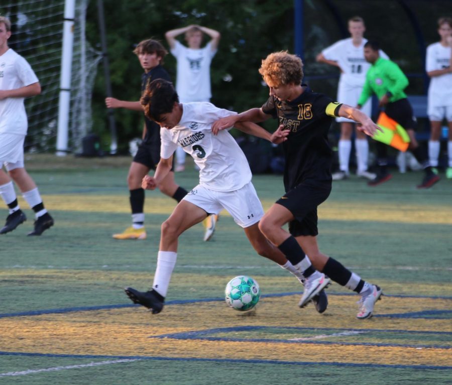 Jonah Bishop '22 fights off a challenge from an opposing defender.