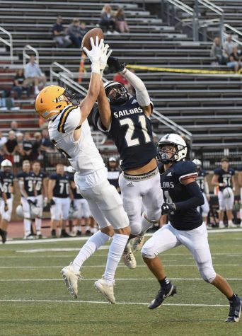 Wide Receiver Ian Masek 22 reels in a crucial reception over a South Christian defensive back Friday. 