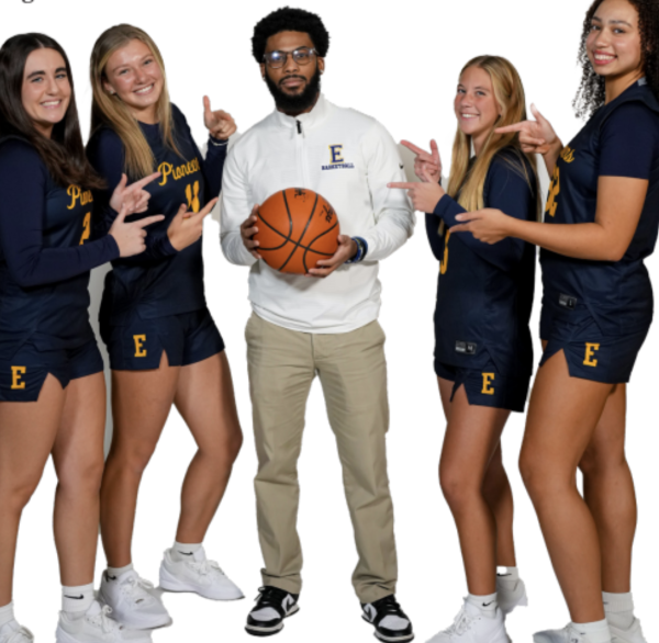Mady Suzio ‘27, Jane Weaver ‘27,
Livia Burgess ‘27, and Sienna Gills ‘26 pose with their assistant coach, Richard Parrott.